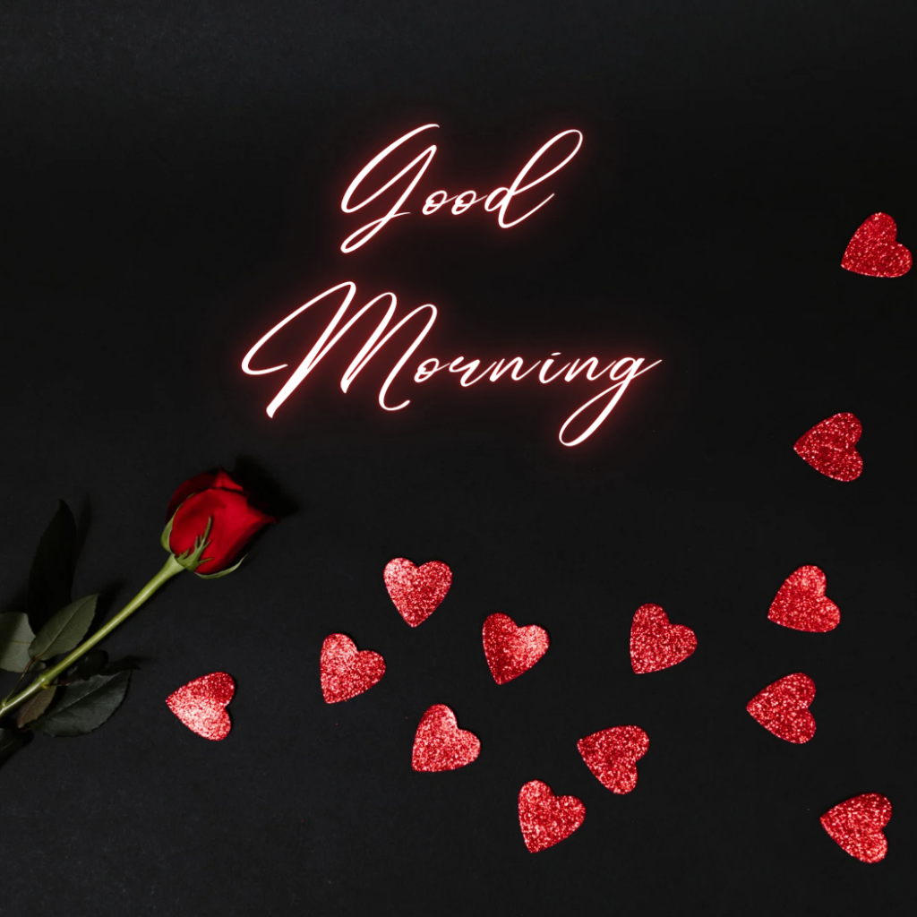 good morning word on black background with rose pieces